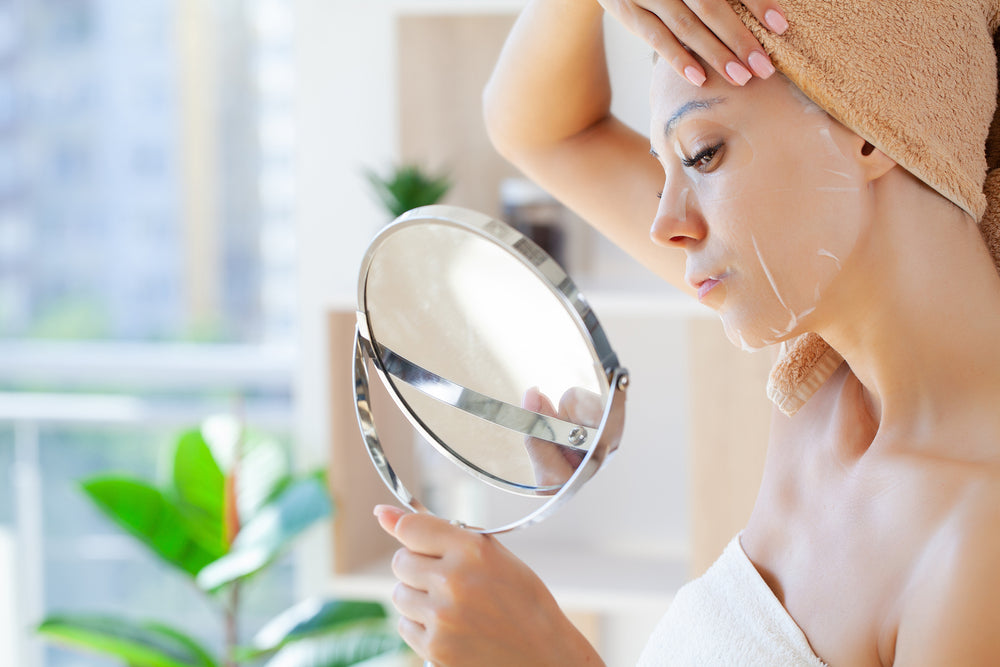 Beauty Collective - multi-masking - woman applying mask on her face