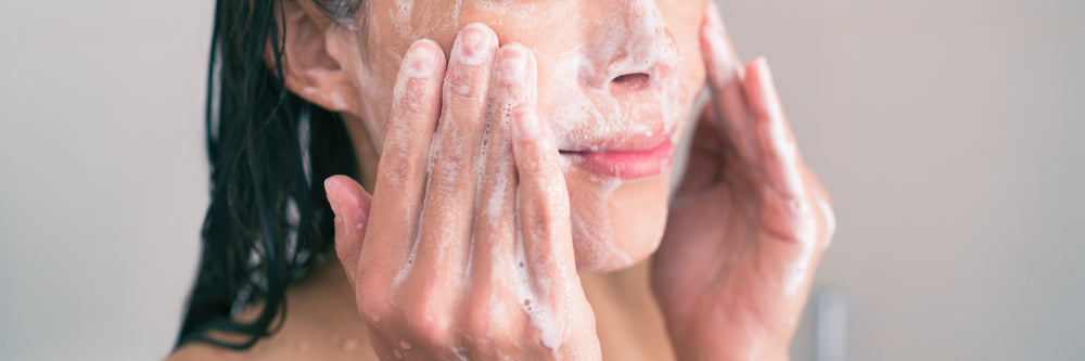 woman cleansing skin